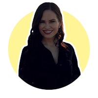 a woman smiling in front of a yellow circle